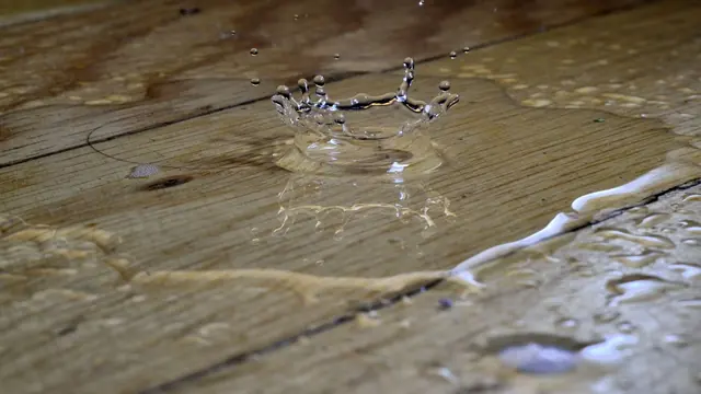 Water pooling on wood floor planks